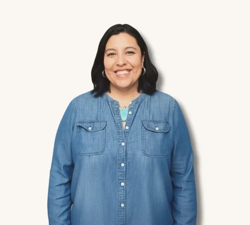 Blanca Martinez Rolle in a blue denim shirt against a light background