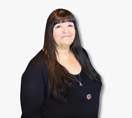 Portrait of Eleanor De Aguero with long dark hair wearing a black top against a white background