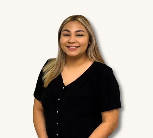 Portrait of Erica Rivera in a black top against a white background