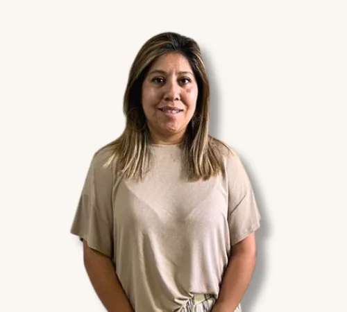 Guadalupe Alaniz standing against a plain light background