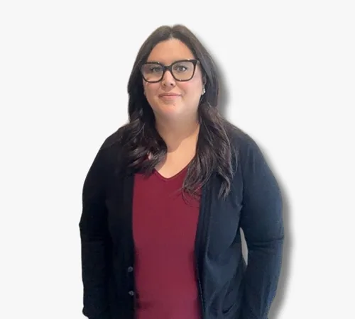 Portrait of Jessica Reyes wearing glasses, a maroon top, and a black cardigan on a white background