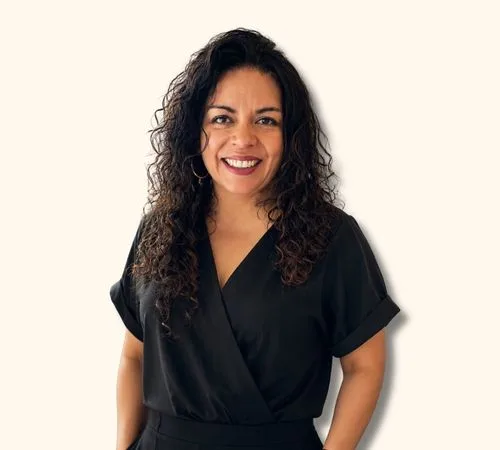 Portrait of Maggie Provencio in a black outfit against a light background